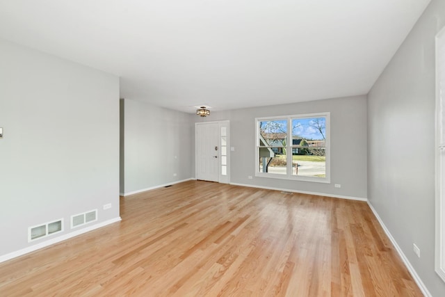 empty room with light wood-type flooring