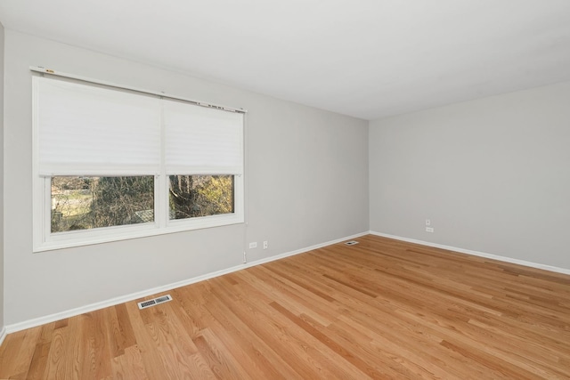 unfurnished room featuring light hardwood / wood-style flooring