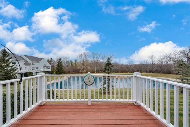 wooden terrace featuring a yard