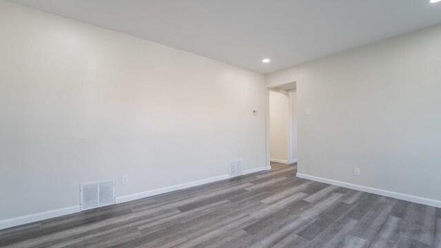 unfurnished room featuring dark hardwood / wood-style floors