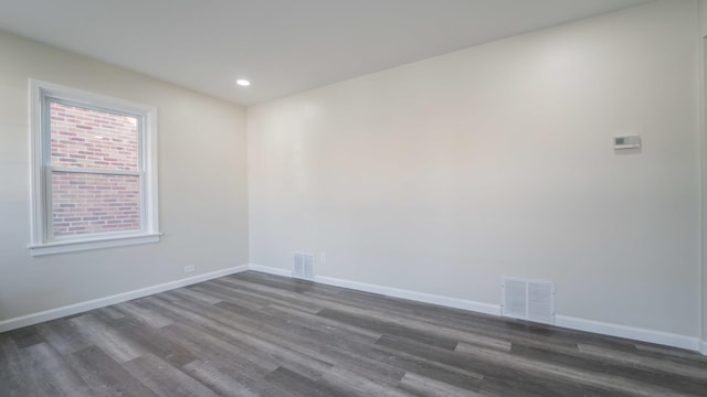 empty room with dark hardwood / wood-style floors