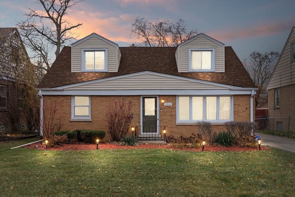 view of front of house with a lawn