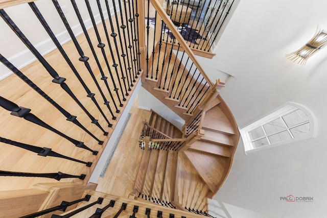 stairs with wood-type flooring