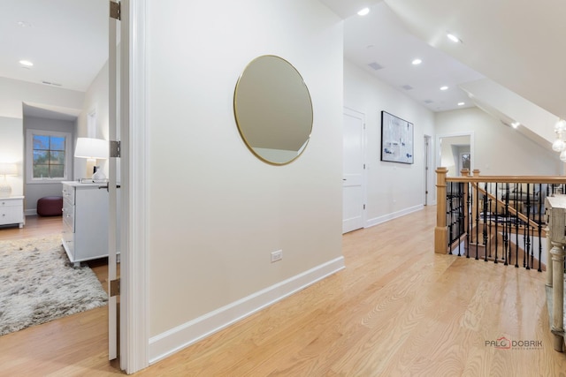 hall with light hardwood / wood-style flooring