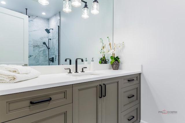 bathroom featuring vanity and a shower with shower door