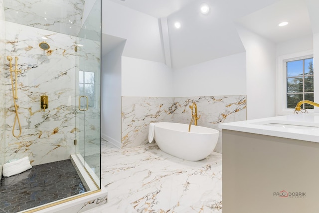 bathroom featuring lofted ceiling, independent shower and bath, and vanity