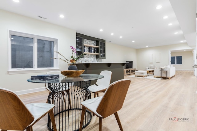 dining room featuring light hardwood / wood-style flooring