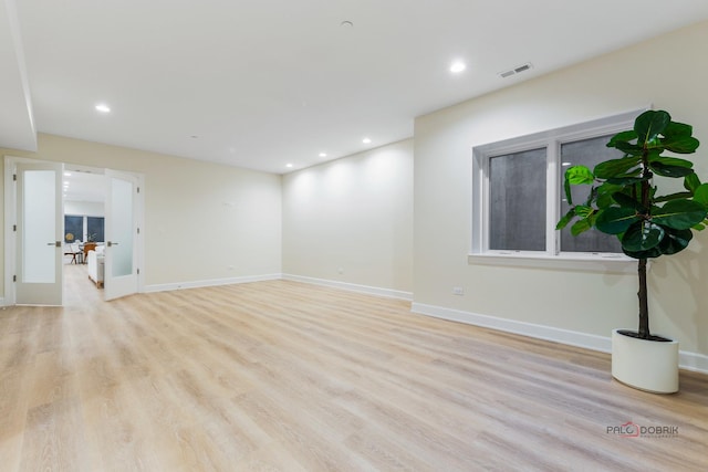 spare room featuring light hardwood / wood-style floors