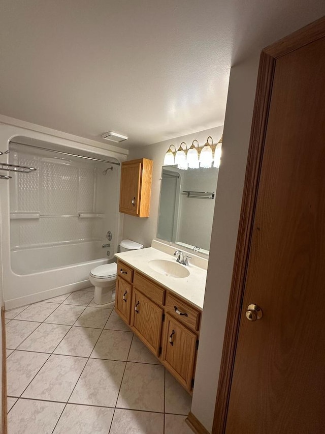 full bathroom featuring tile patterned floors, vanity, tub / shower combination, and toilet