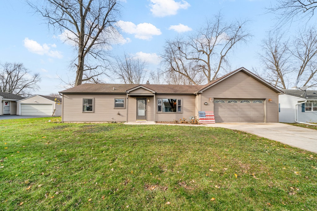 single story home with a front yard and a garage