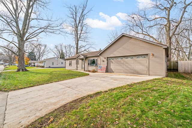 single story home with a front yard and a garage