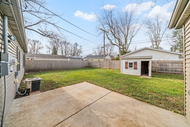 view of yard with an outdoor structure, a patio area, and central air condition unit