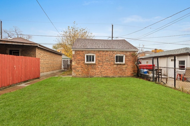 rear view of house with a lawn