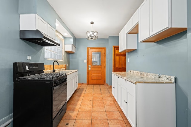 kitchen featuring pendant lighting, white cabinets, sink, light tile patterned floors, and gas stove