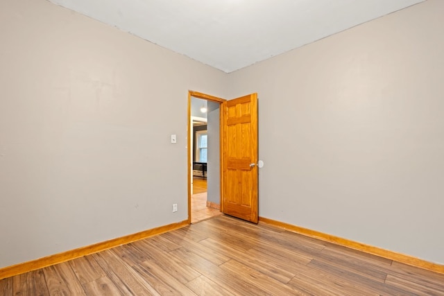 unfurnished room featuring light hardwood / wood-style floors