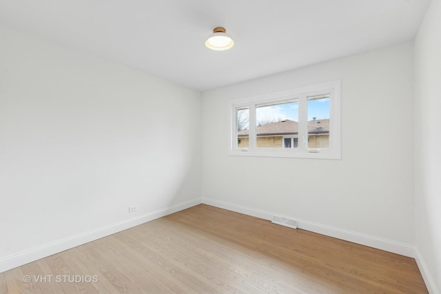 unfurnished room featuring light hardwood / wood-style floors