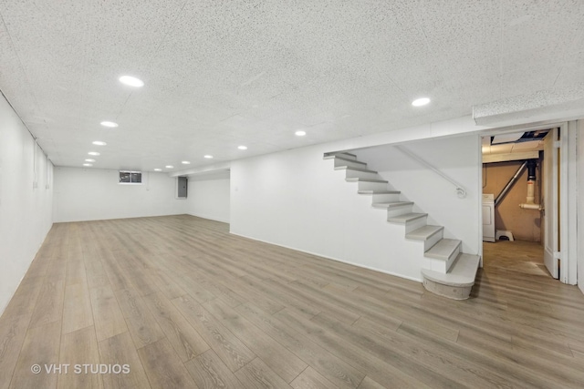 basement featuring light hardwood / wood-style flooring