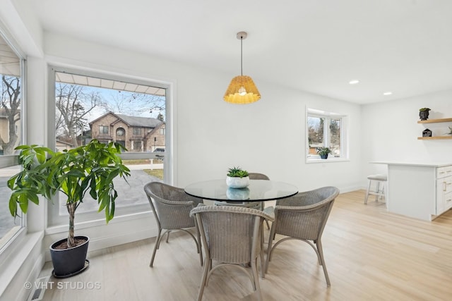 dining room featuring light hardwood / wood-style floors and a wealth of natural light