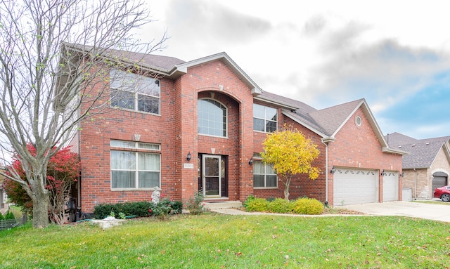 view of front of house featuring a front yard and a garage