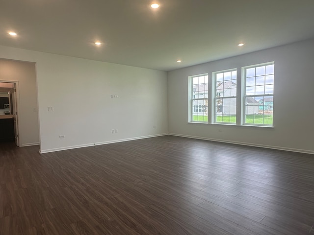 empty room featuring dark wood-type flooring