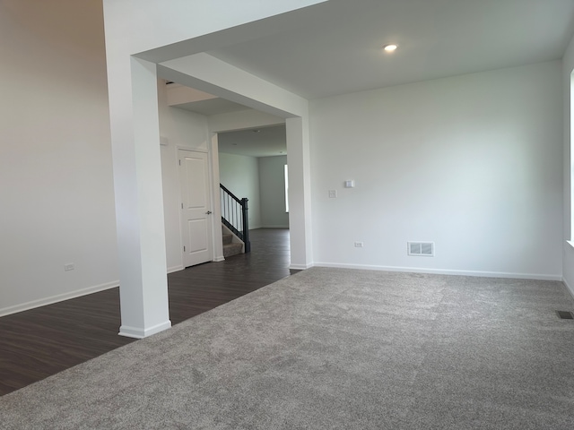 spare room with dark hardwood / wood-style flooring