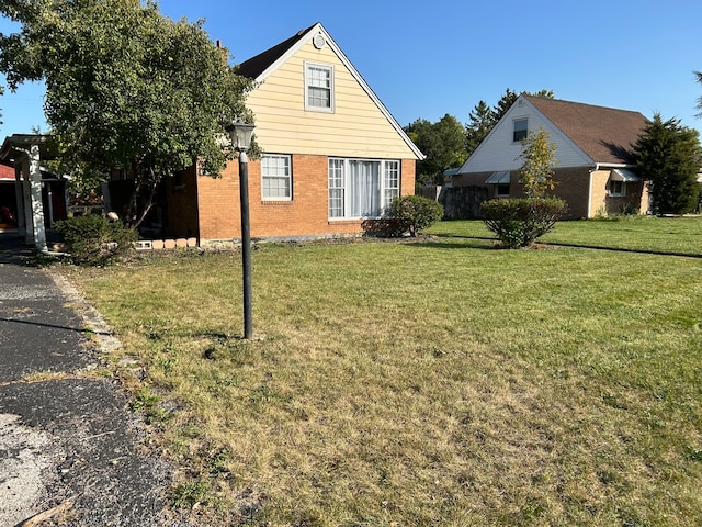 view of property exterior with a yard