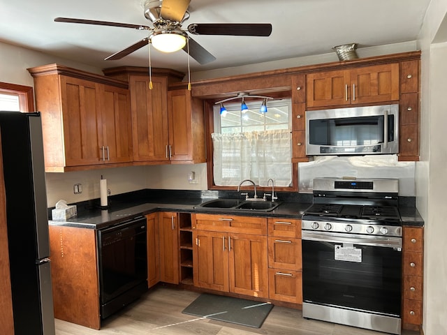 kitchen featuring light wood-type flooring, sink, ceiling fan, and black appliances