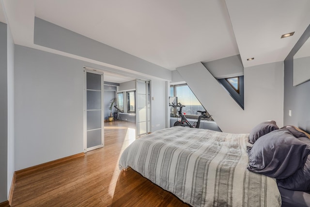 bedroom with hardwood / wood-style flooring