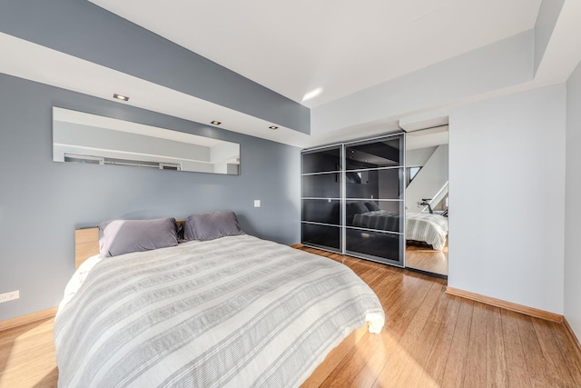 bedroom featuring hardwood / wood-style floors