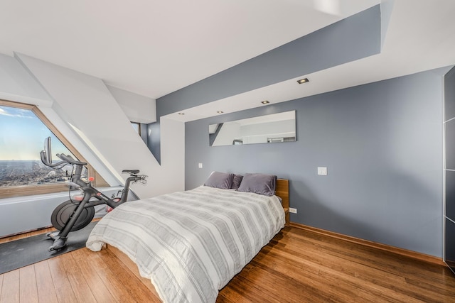 bedroom with hardwood / wood-style floors