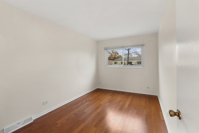 empty room featuring hardwood / wood-style floors