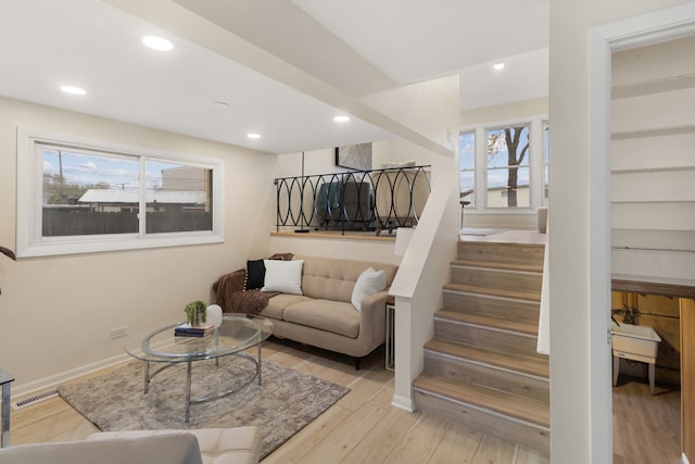 living room featuring a healthy amount of sunlight and light wood-type flooring