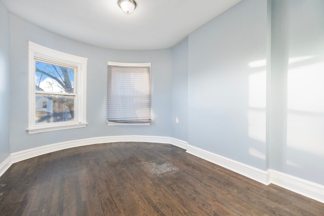 empty room with hardwood / wood-style floors