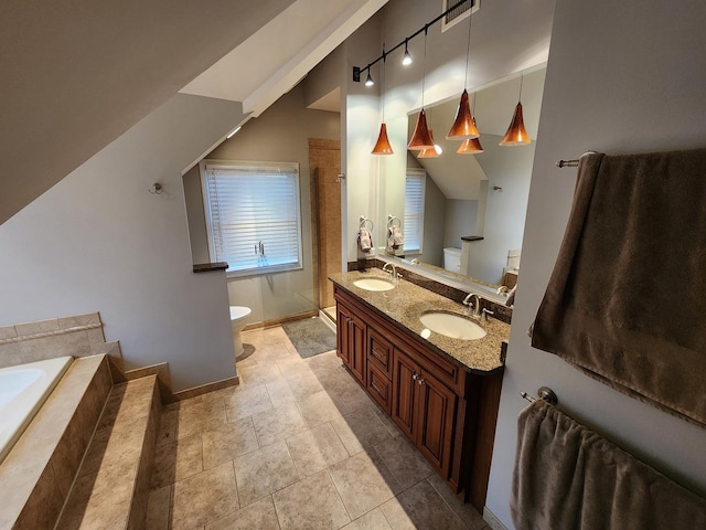 full bathroom with vanity, separate shower and tub, toilet, and vaulted ceiling