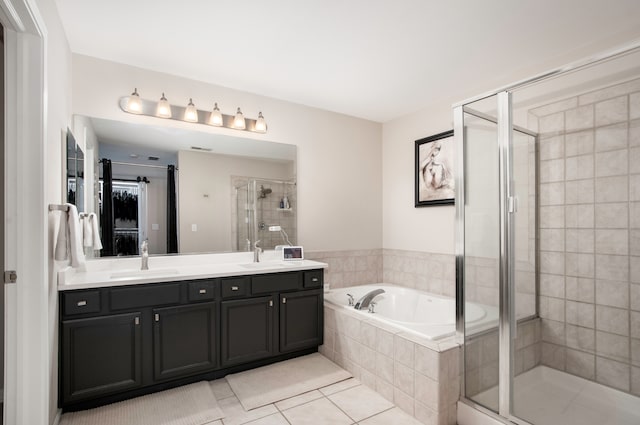 bathroom featuring tile patterned floors, vanity, and independent shower and bath