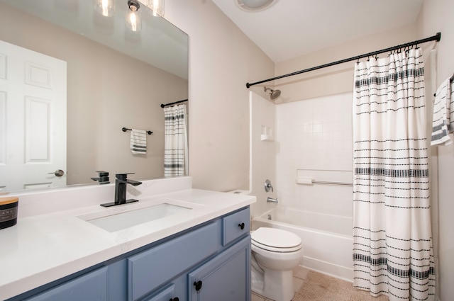 full bathroom with tile patterned floors, shower / tub combo with curtain, vanity, and toilet