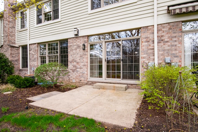 doorway to property with a patio