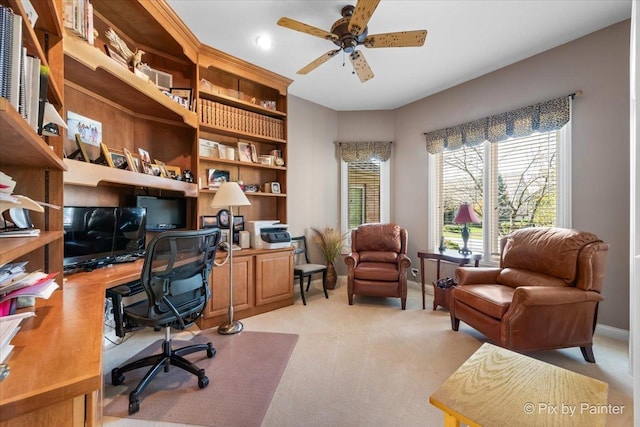 office featuring ceiling fan and light colored carpet