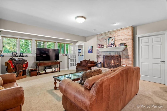 carpeted living room with a brick fireplace