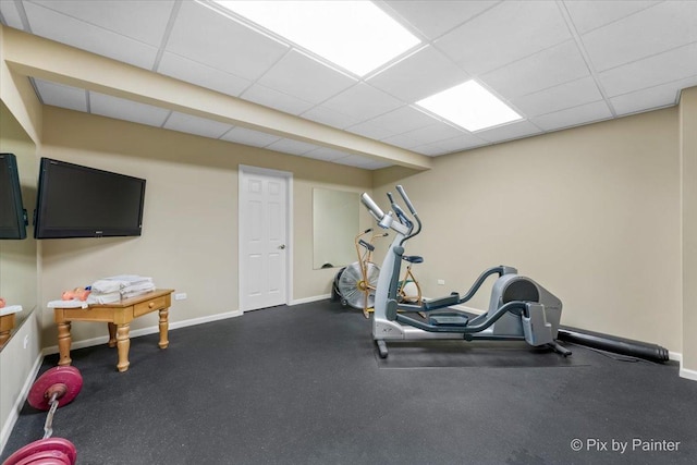 exercise room featuring a paneled ceiling