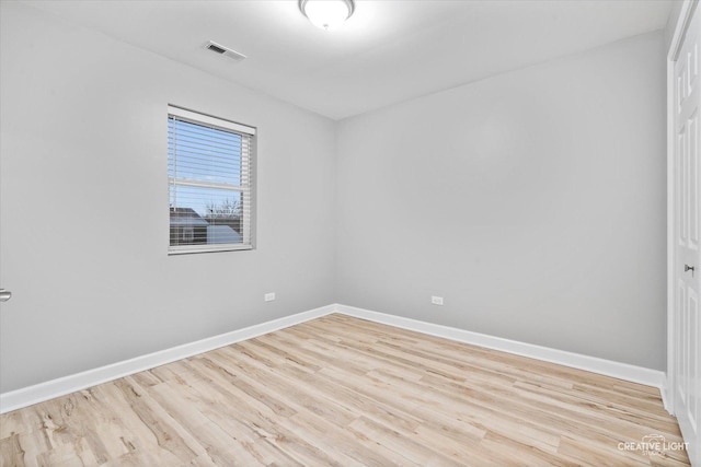 unfurnished room with light hardwood / wood-style flooring