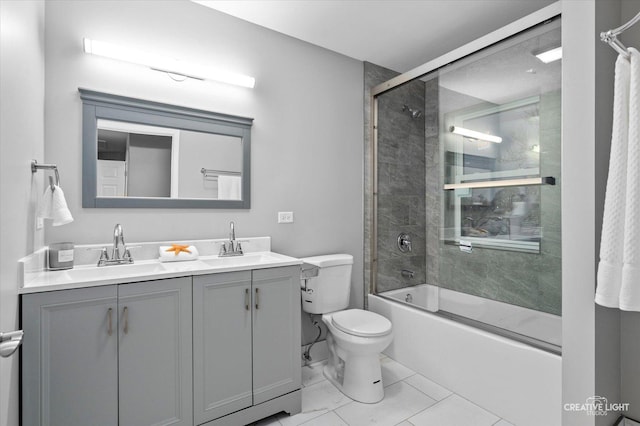 full bathroom with vanity, toilet, and bath / shower combo with glass door