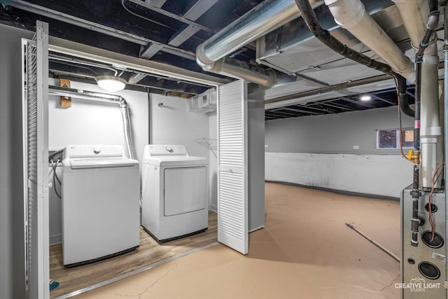 basement with washer and clothes dryer