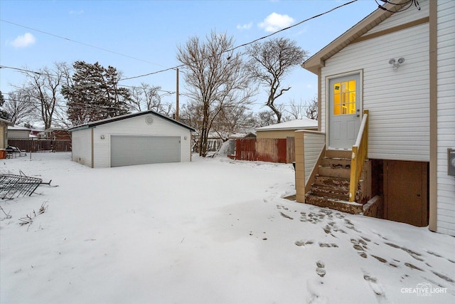 view of snow covered garage