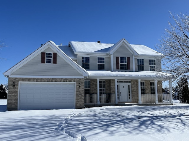 view of front of house featuring a porch and a garage