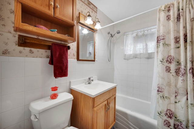 full bathroom with shower / bath combo with shower curtain, vanity, tile walls, and toilet