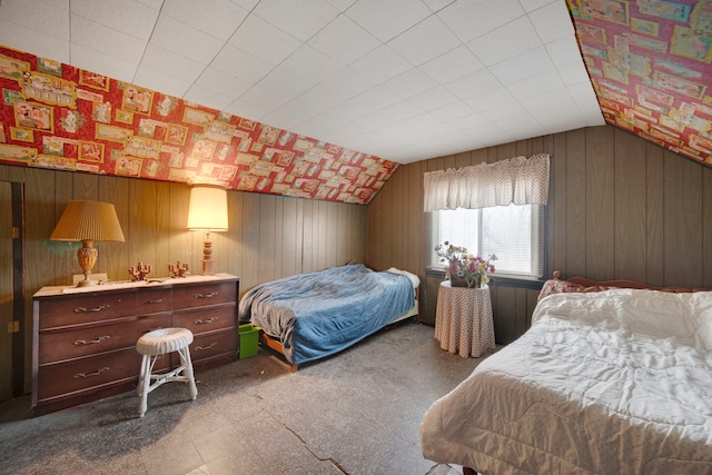 bedroom featuring wood walls and vaulted ceiling