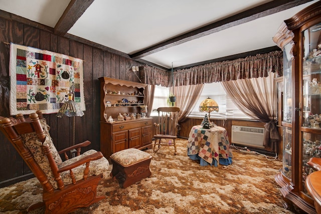 living area with carpet flooring, beam ceiling, wooden walls, and cooling unit