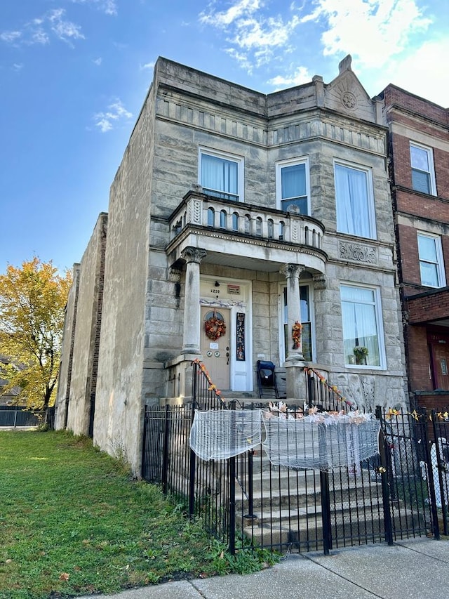 view of front of home with a balcony