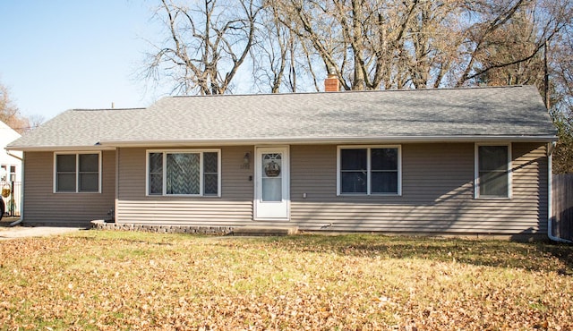 ranch-style home with a front lawn